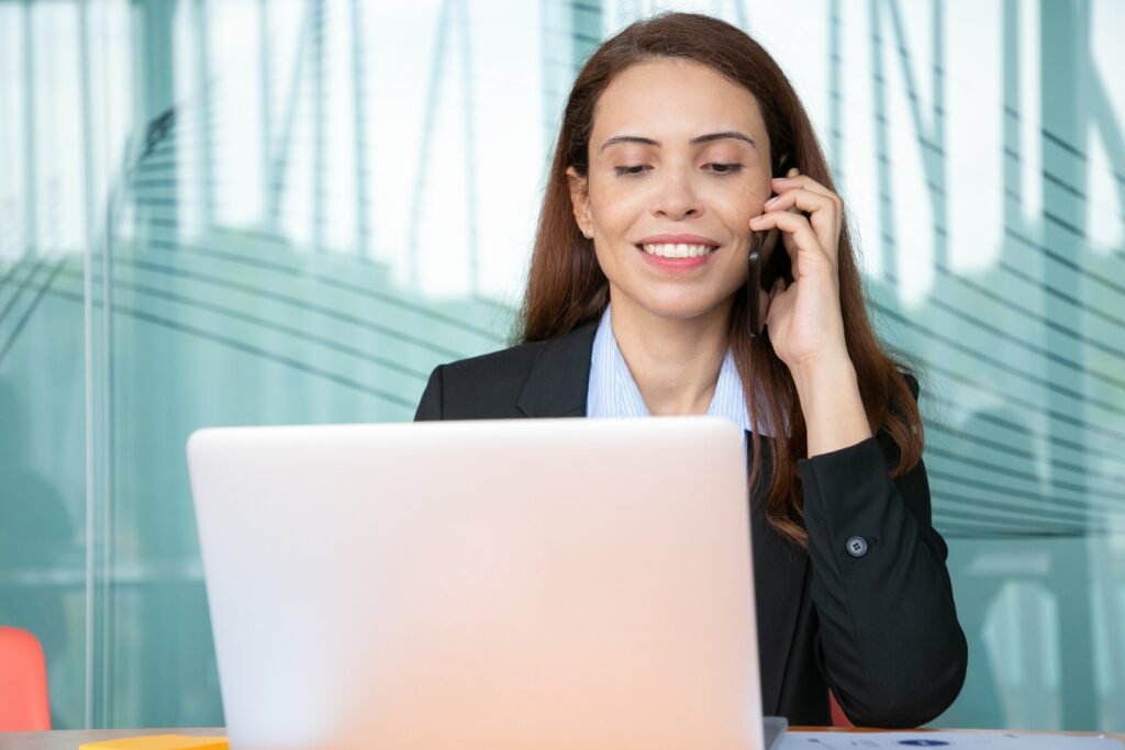 positive pretty young businesswoman talking mobile phone smiling working computer office using laptop table 74855 10341 positive pretty young businesswoman talking mobile phone smiling working computer office using laptop table 74855 10341 Dizilia.in